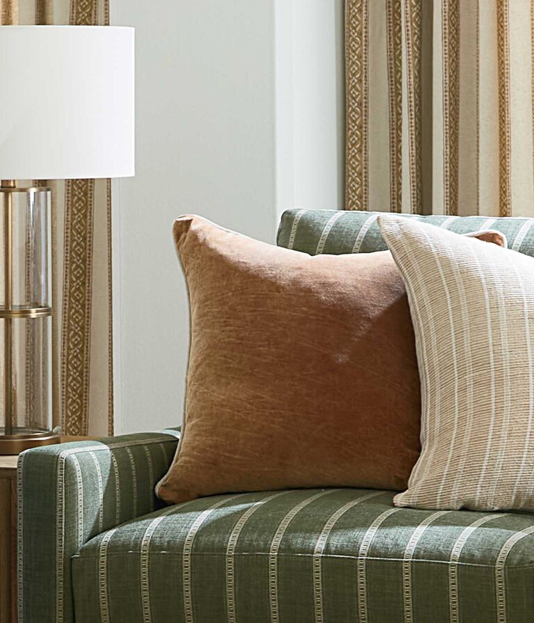 Upholstered sofa with accent pillows