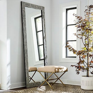 Stool in front of standing mirror