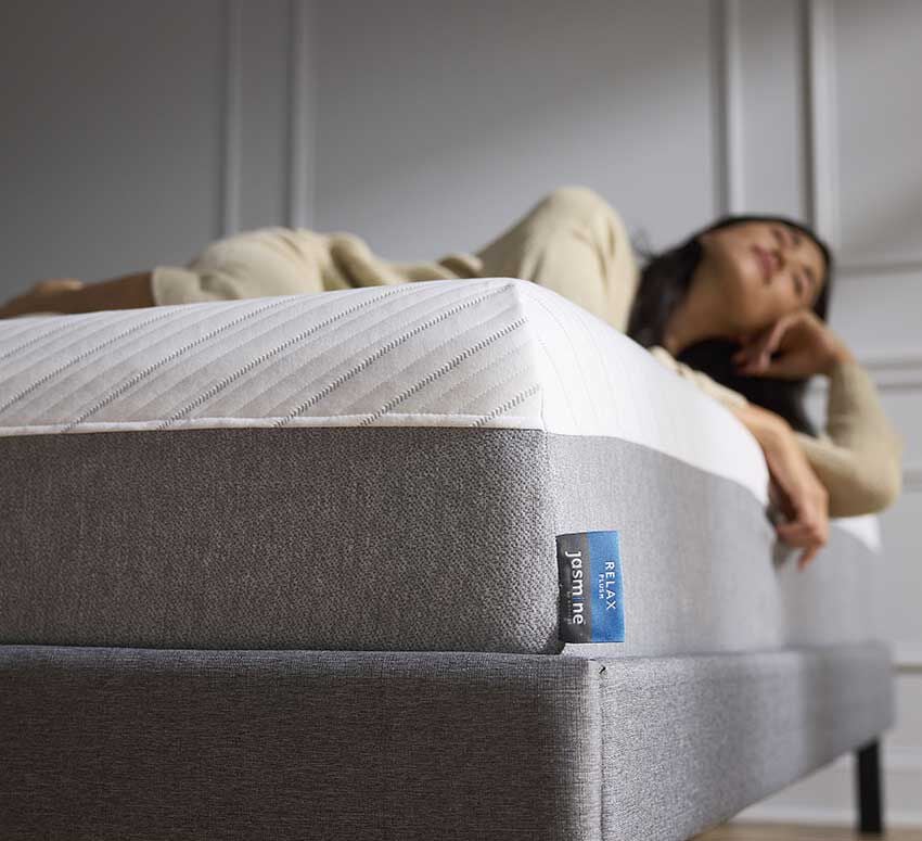 Model laying on mattress Model laying on mattress