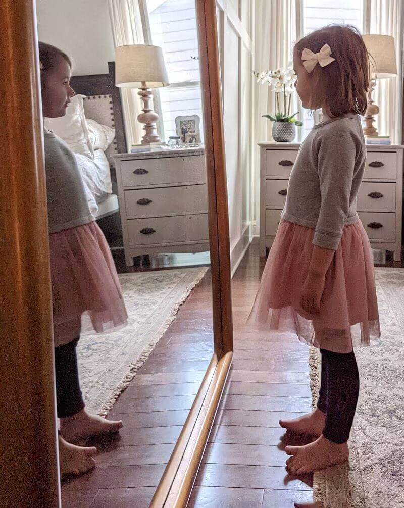 Little girl looking into the Kentridge Leaner Mirror