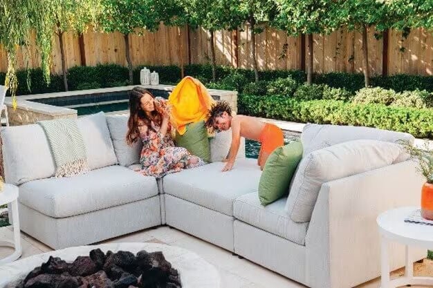 kids playing on an outdoor couch