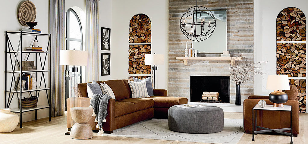 Leather sofa and accent chair in living room with gray ottoman