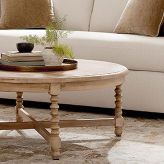 Wood cocktail table in front of beige sofa