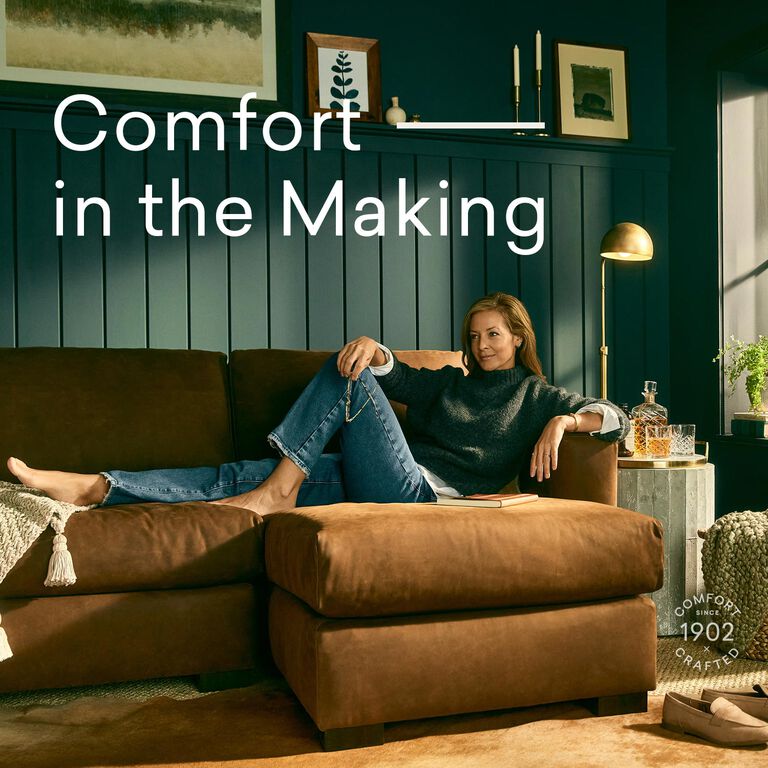 Woman sitting comfortably on Weldon leather sofa