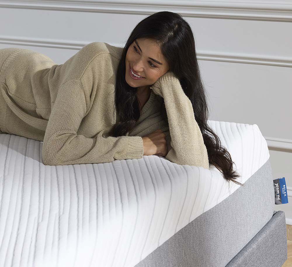 Model laying on Jasmine mattress