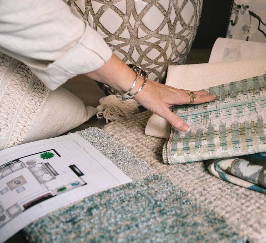 Designer touching fabric