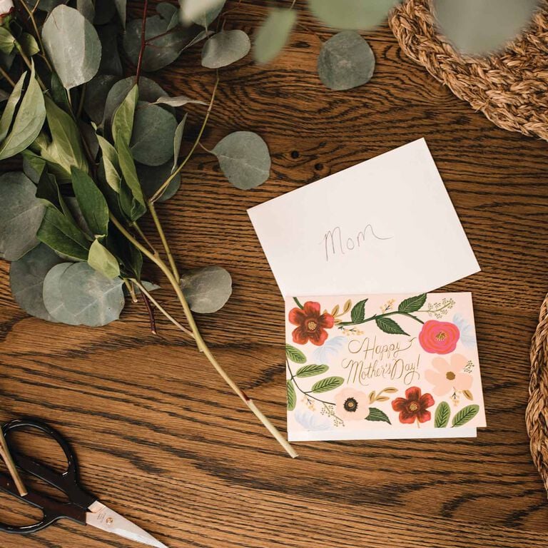 Wood table top with mothers day card on top