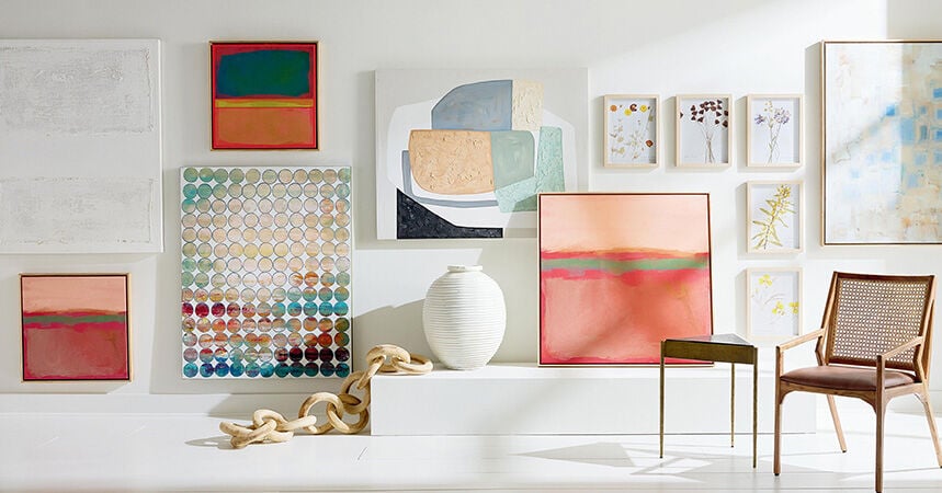 Different styles of wall art displayed on a white wall