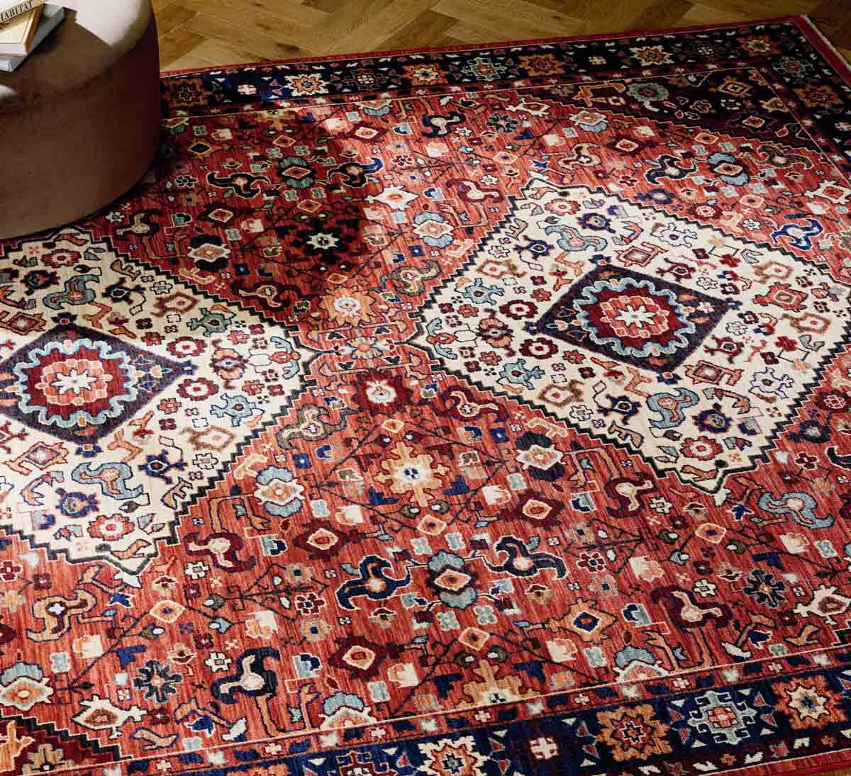 Red rug with brown ottoman