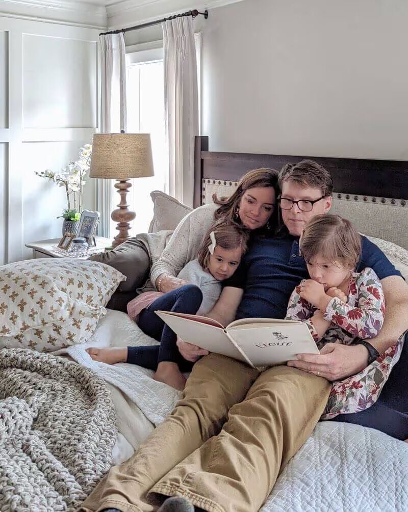 family reading in bed