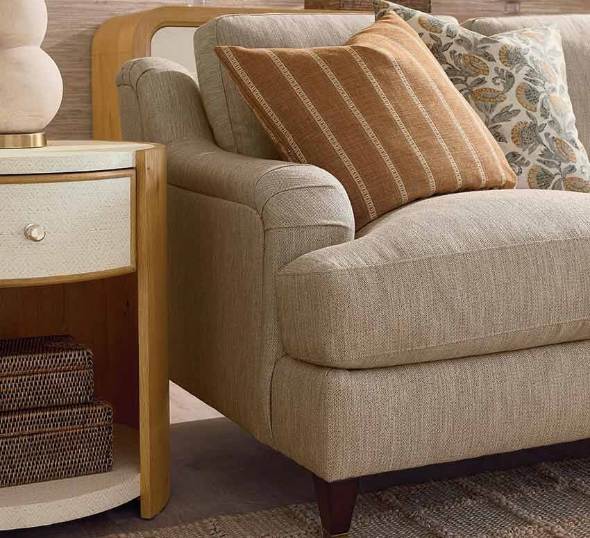 Sofa with accent pillows and side table