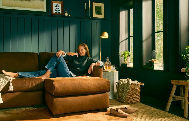 Woman sitting on Weldon sectional 