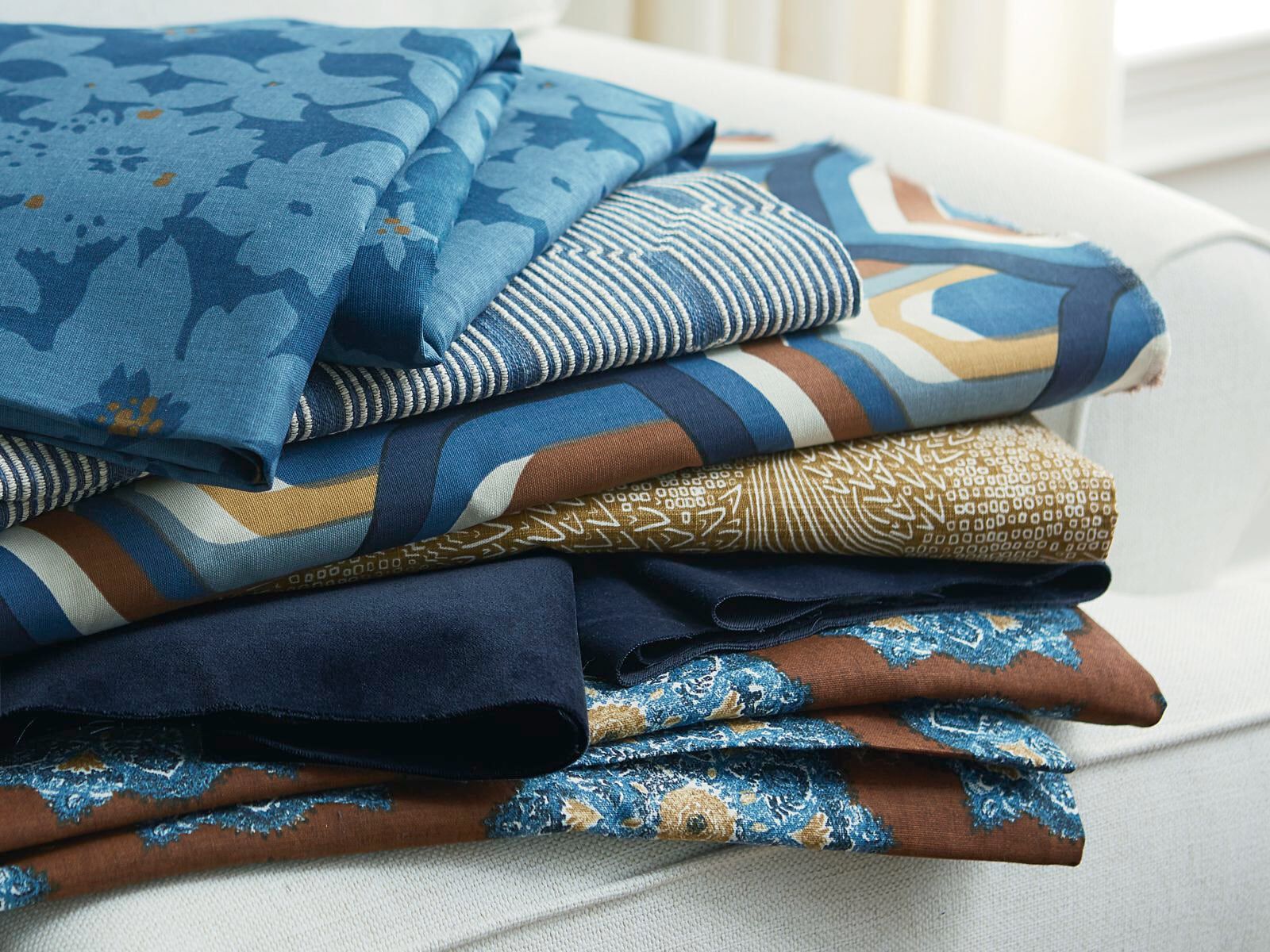 a stack of folded fabrics