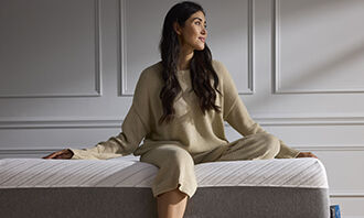 Woman sitting on Jasmine Mattress