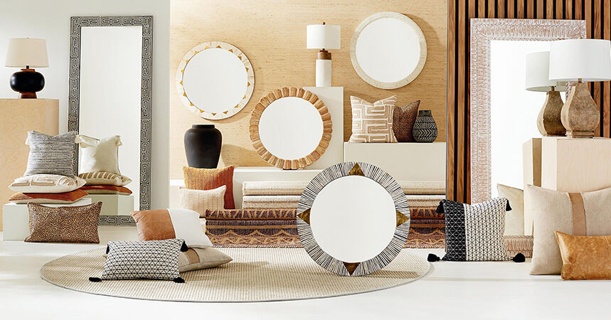 Displayed array of mirrors, lamps, rugs and accent pillows