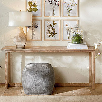 Oak console table against wall