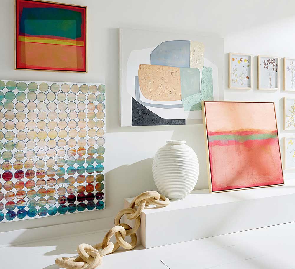 Array of wall art hanging on wall