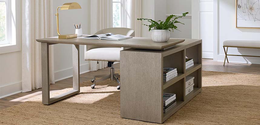 Narrow desk placed against wall with armless desk chair