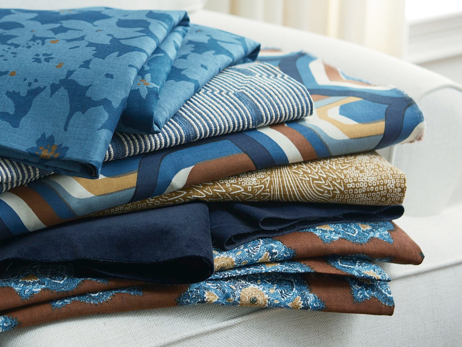 a stack of folded fabrics