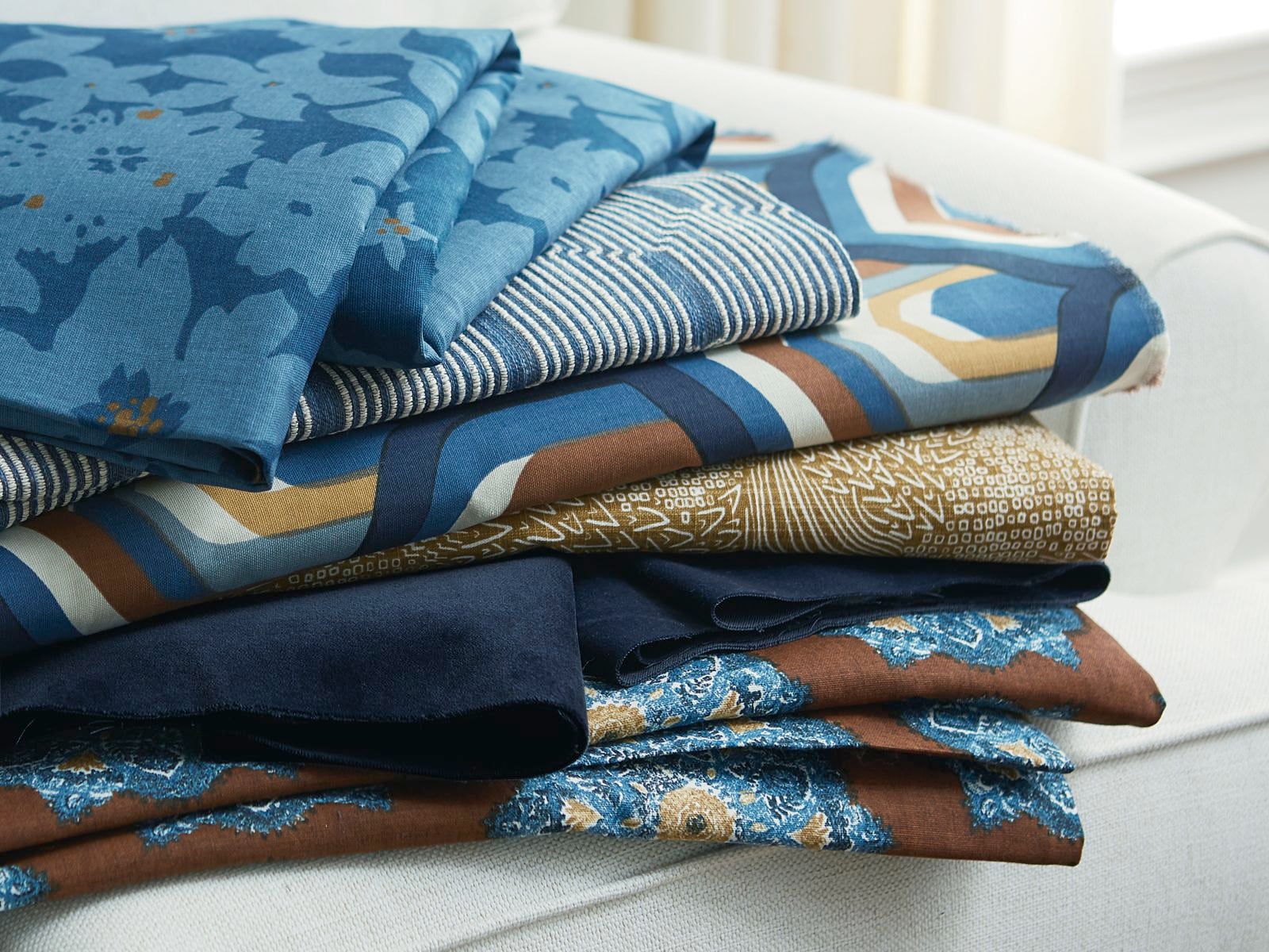 a stack of folded fabrics a stack of folded fabrics